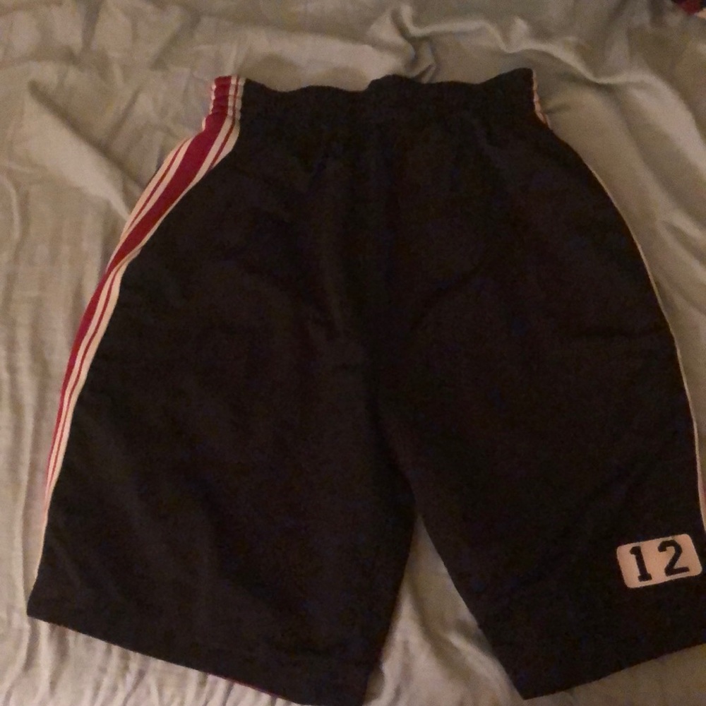 Reversible red and black gym shorts